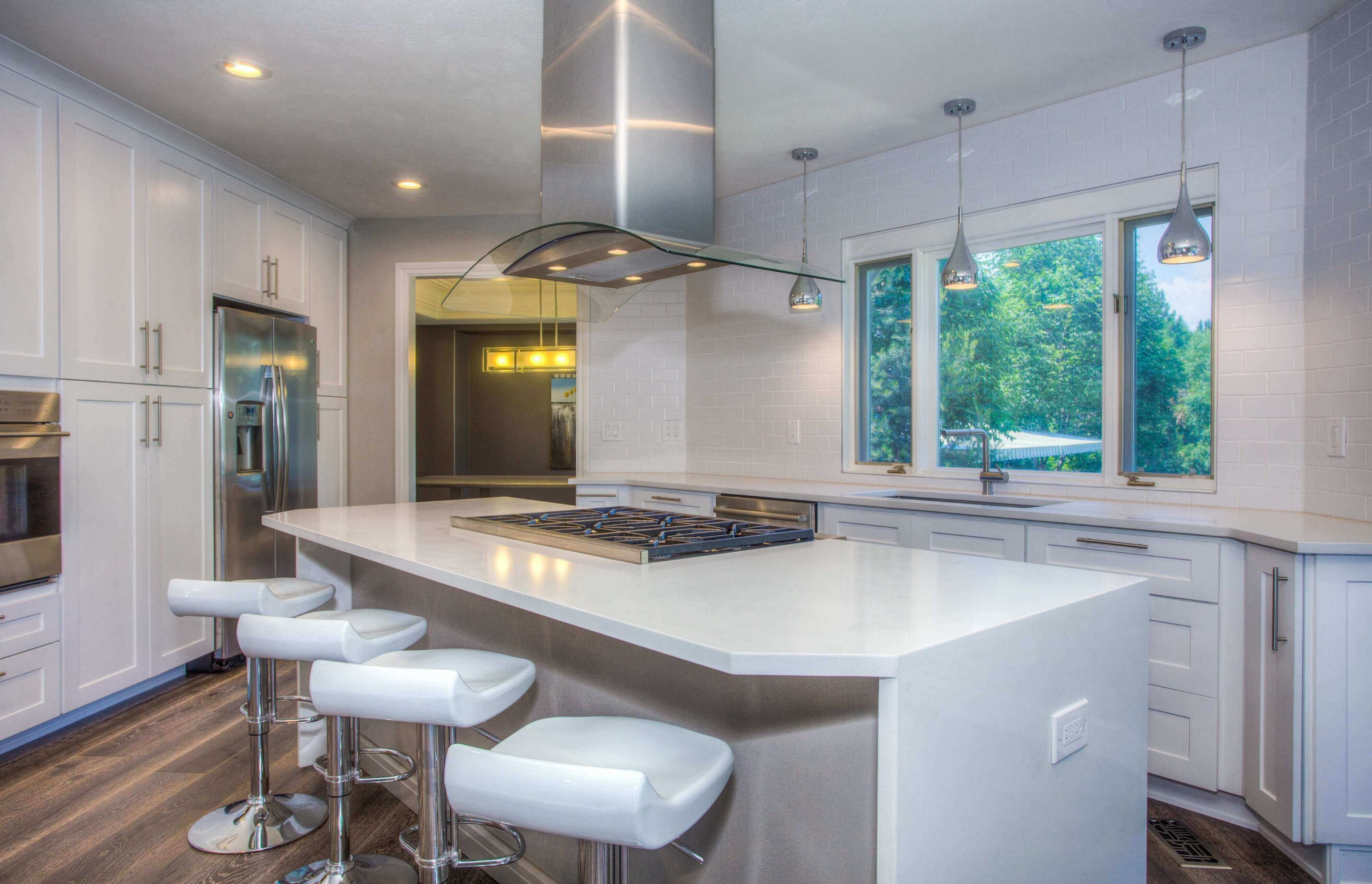 A beautiful white kitchen with white marble and tile. Cleaned with Shadazzle cleaner.